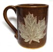 white & brown leaf cup